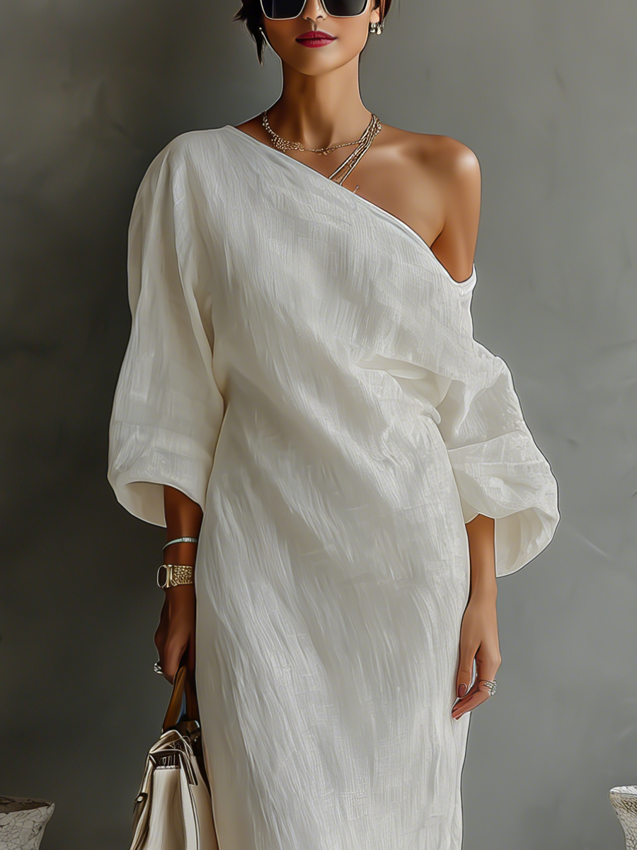 Elena ∙ An elegant, flowing dress with bare shoulders