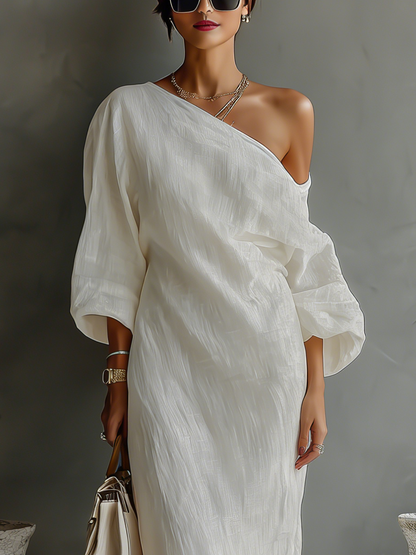 Elena ∙ An elegant, flowing dress with bare shoulders