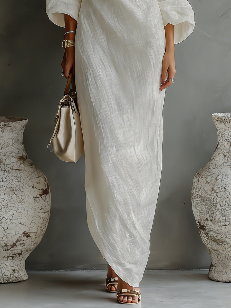 Elena ∙ An elegant, flowing dress with bare shoulders